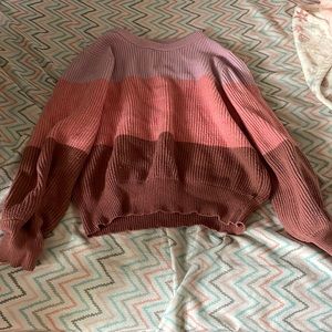 purple, salmon, and brown sweater